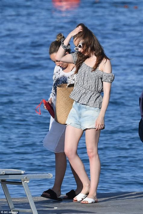 Lily Collins showcases her incredible figure in an aztec bikini